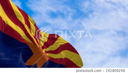 The flag of Arizona waving in the wind on a clear day The flag of Arizona waving in the wind on a clear day 142809248