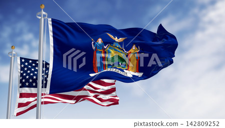 New York State flag waving with the American flag on a clear day New York State flag waving with the American flag on a clear day 142809252