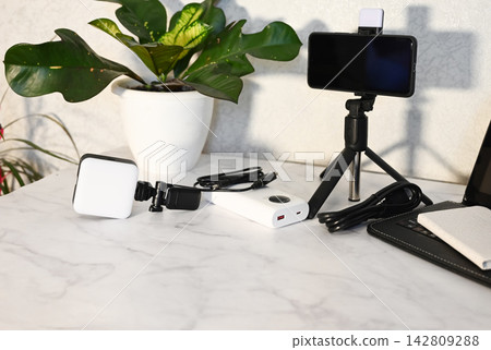 Interior of studio with photographer's workplace, drawers and folding screen Interior of studio with photographer's workplace, drawers and folding screen 142809288