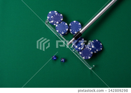 Dice and chips on a green felt gaming table, a poker game in a casino. Casino dice Dice and chips on a green felt gaming table, a poker game in a casino. Casino dice 142809298