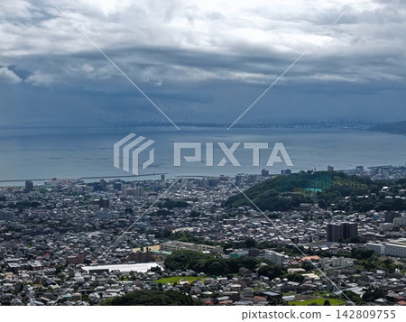 Aerial photograph overlooking the city of Beppu, Oita Prefecture, and Beppu Bay. Aerial photograph overlooking the city of Beppu, Oita Prefecture, and Beppu Bay. 142809755