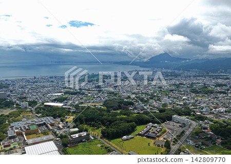Aerial photograph capturing the coastal urban area and dome-shaped structures of Beppu City, Oita Prefecture. Aerial photograph capturing the coastal urban area and dome-shaped structures of Beppu City, Oita Prefecture. 142809770