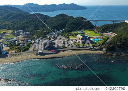 Aerial photographs capturing the sandy beaches, rocky reefs, and resort hotels of Naruto City, Tokushima Prefecture. Aerial photographs capturing the sandy beaches, rocky reefs, and resort hotels of Naruto City, Tokushima Prefecture. 142809798