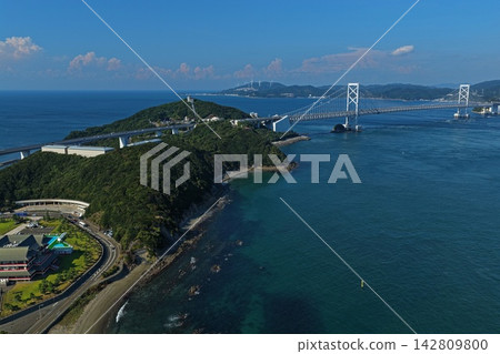 Aerial photograph of the Naruto Strait, showing the suspension bridge and islands in Naruto City, Tokushima Prefecture. 142809800