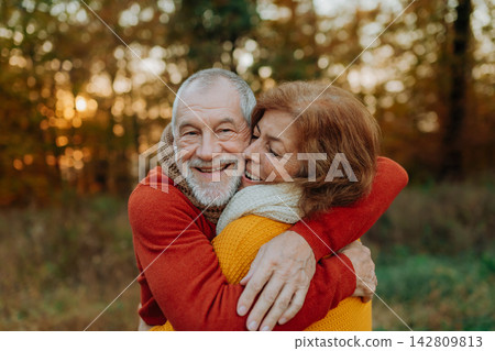 Romantic moment between senior couple, standing in autumn nature. Romantic moment between senior couple, standing in autumn nature. 142809813