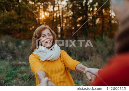 Romantic moment between senior couple, standing in autumn nature. Romantic moment between senior couple, standing in autumn nature. 142809815