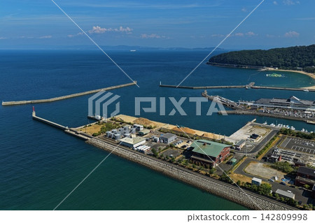 Aerial photograph capturing the coastal port and lighthouse of Sumoto City, Hyogo Prefecture. Aerial photograph capturing the coastal port and lighthouse of Sumoto City, Hyogo Prefecture. 142809998