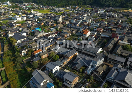 Aerial photograph capturing a residential area with tiled roofs in Mima City, Tokushima Prefecture. Aerial photograph capturing a residential area with tiled roofs in Mima City, Tokushima Prefecture. 142810201