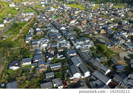 An aerial photograph capturing the townscape of Mima City, Tokushima Prefecture, with its distinctive tiled roofs. 142810211
