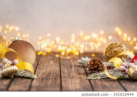 Golden Christmas Ornaments with Snowflake and Star on Wood Golden Christmas Ornaments with Snowflake and Star on Wood 142810444