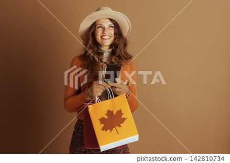 Elegant Woman with Autumn Shopping and Phone Elegant Woman with Autumn Shopping and Phone 142810734