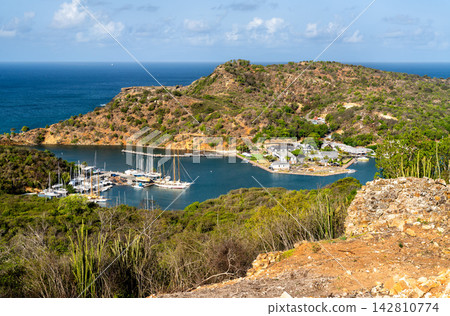 Scenic aerial vista of boats moored at historic Nelson's Dockyard in English Harbour, Antigua and Barbuda, from Dow's Hill Scenic aerial vista of boats moored at historic Nelson's Dockyard in English Harbour, Antigua and Barbuda, from Dow's Hill 142810774