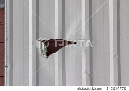 Damaged Corrugated Fence Damaged Corrugated Fence 142810778