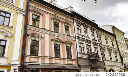 View of historic city architecture feature traditional residential building. Facades display classic design elements, detailed windows and textured walls, capturing cultural heritage urban environment View of historic city architecture feature traditional residential building. Facades display classic design elements, detailed windows and textured walls, capturing cultural heritage urban environment 142810988