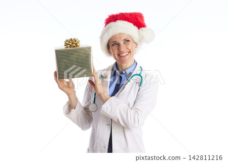 Festive Doctor Holding Green Christmas Gift Festive Doctor Holding Green Christmas Gift 142811216