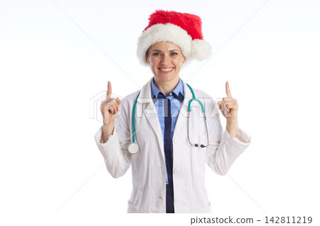 Friendly Christmas Doctor Pointing Upward Friendly Christmas Doctor Pointing Upward 142811219