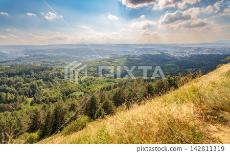 View of the mountains and Kislovodsk from the observation decks of the Kislovodsk Park. Evening sunset over the mountains of Kislovodsk. View of the mountains and Kislovodsk from the observation decks of the Kislovodsk Park. Evening sunset over the mountains of Kislovodsk. 142811319