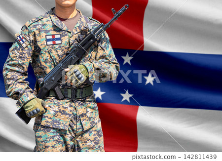 Netherlands Antilles flag with soldier holding assault rifle Netherlands Antilles flag with soldier holding assault rifle 142811439
