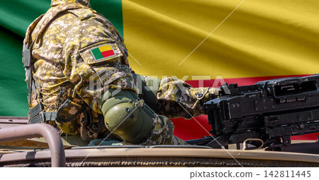Benin flag with soldier at machinegun turret Benin flag with soldier at machinegun turret 142811445