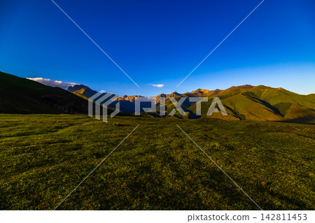 Majestic mountain landscape in Kyrgyzstan under blue sky, wide angle Majestic mountain landscape in Kyrgyzstan under blue sky, wide angle 142811453