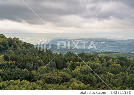 Layers of green mountains and hills in the haze during sunset. Panoramic View of Green hills and Meadow. Layers of green mountains and hills in the haze during sunset. Panoramic View of Green hills and Meadow. 142811588