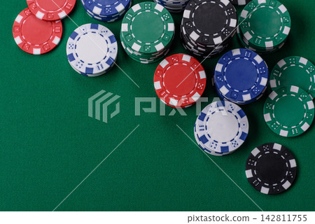 Multi colored gaming chips for betting in casino games. Betting chips Multi colored gaming chips for betting in casino games. Betting chips 142811755