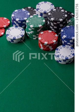Multi colored gaming chips for betting in casino games. Betting chips Multi colored gaming chips for betting in casino games. Betting chips 142811756