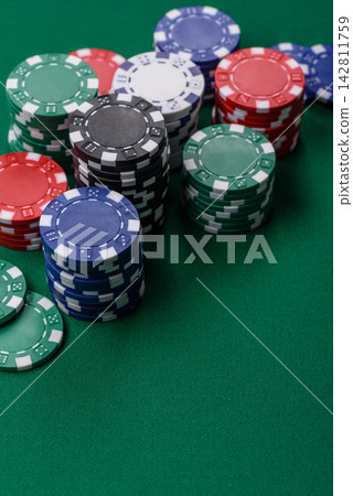 Multi colored gaming chips for betting in casino games. Betting chips Multi colored gaming chips for betting in casino games. Betting chips 142811759
