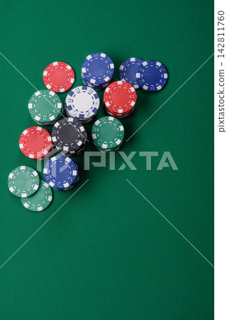 Multi colored gaming chips for betting in casino games. Betting chips Multi colored gaming chips for betting in casino games. Betting chips 142811760