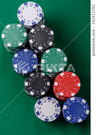 Multi colored gaming chips for betting in casino games. Betting chips Multi colored gaming chips for betting in casino games. Betting chips 142811765