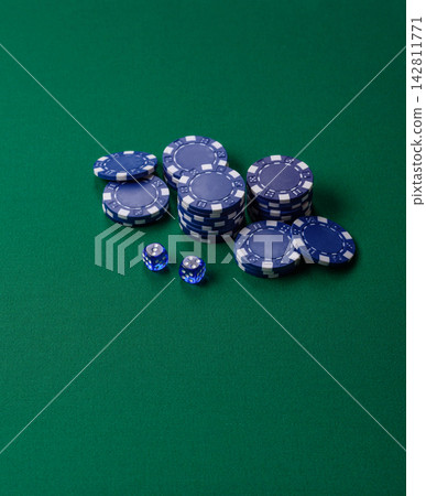 Multicolored casino chips as a conceptual backdrop for gambling games like poker, blackjack Multicolored casino chips as a conceptual backdrop for gambling games like poker, blackjack 142811771