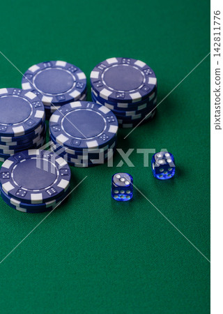 Multicolored casino chips as a conceptual backdrop for gambling games like poker, blackjack Multicolored casino chips as a conceptual backdrop for gambling games like poker, blackjack 142811776