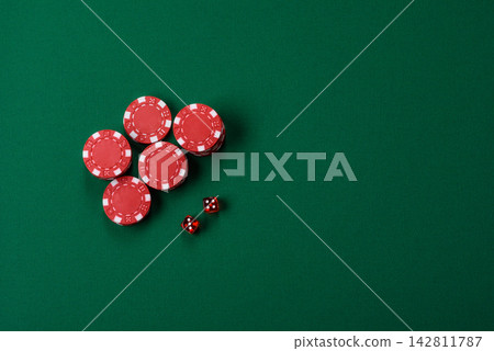 Multicolored casino chips as a conceptual backdrop for gambling games like poker, blackjack Multicolored casino chips as a conceptual backdrop for gambling games like poker, blackjack 142811787