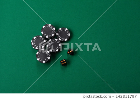 Multicolored casino chips as a conceptual backdrop for gambling games like poker, blackjack Multicolored casino chips as a conceptual backdrop for gambling games like poker, blackjack 142811797