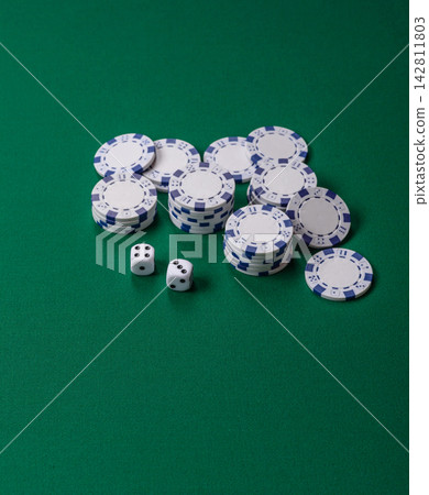 Multicolored casino chips as a conceptual backdrop for gambling games like poker, blackjack Multicolored casino chips as a conceptual backdrop for gambling games like poker, blackjack 142811803