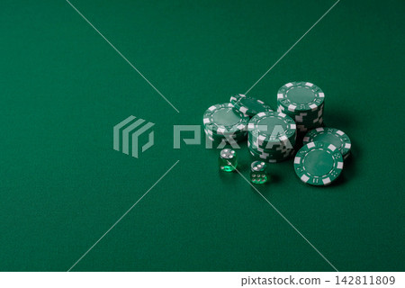 Multicolored casino chips as a conceptual backdrop for gambling games like poker, blackjack Multicolored casino chips as a conceptual backdrop for gambling games like poker, blackjack 142811809