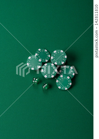 Multicolored casino chips as a conceptual backdrop for gambling games like poker, blackjack Multicolored casino chips as a conceptual backdrop for gambling games like poker, blackjack 142811810