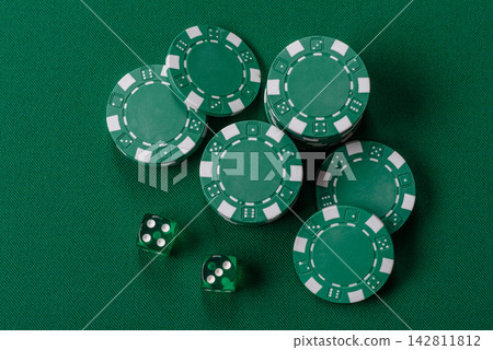 Multicolored casino chips as a conceptual backdrop for gambling games like poker, blackjack Multicolored casino chips as a conceptual backdrop for gambling games like poker, blackjack 142811812