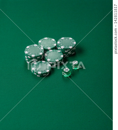 Multicolored casino chips as a conceptual backdrop for gambling games like poker, blackjack Multicolored casino chips as a conceptual backdrop for gambling games like poker, blackjack 142811817