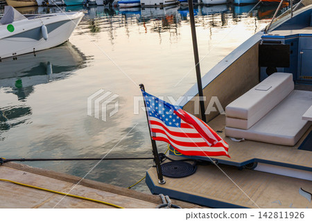 Motorboat with American flag moored in Cannes Motorboat with American flag moored in Cannes 142811926