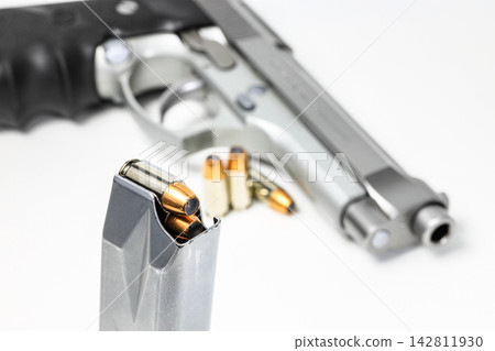 bullet 9mm JHP ( Jacketed Hollow Point ) Shell Shock Technologies (NAS3) in magazines and 9mm postal gun in background. 142811930