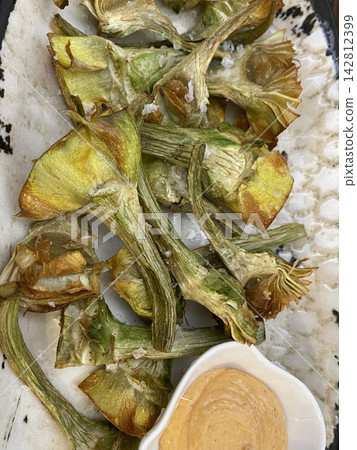 Artichokes Prepared and Served as a Mediterranean Vegetable Dish Artichokes Prepared and Served as a Mediterranean Vegetable Dish 142812399