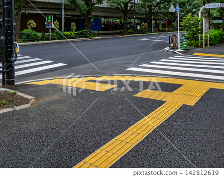 Example of braille block installation in front of a pedestrian crossing Example of braille block installation in front of a pedestrian crossing 142812619