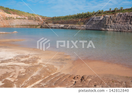 A sand mining operation in Brazil; a fantastic landscape rich in detail and color, featuring a sand mine in Brazil; selective focus. A sand mining operation in Brazil; a fantastic landscape rich in detail and color, featuring a sand mine in Brazil; selective focus. 142812840