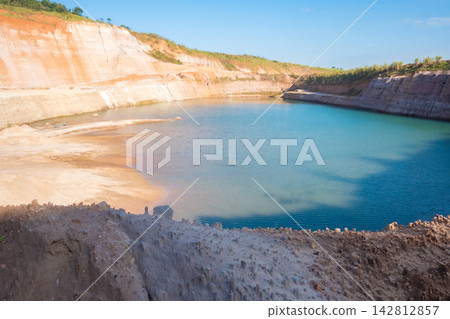A sand mining operation in Brazil; a fantastic landscape rich in detail and color, featuring a sand mine in Brazil; selective focus. A sand mining operation in Brazil; a fantastic landscape rich in detail and color, featuring a sand mine in Brazil; selective focus. 142812857