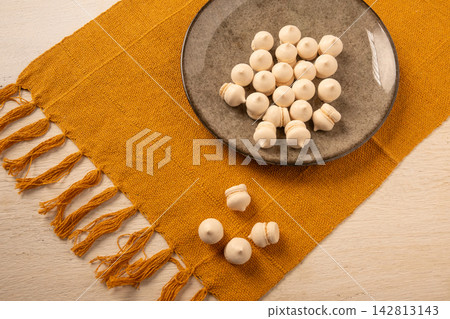 Brazilian sweet meringue, a delicious dessert made of eggs and sugar called "suspiro" in a city in Minas Gerais, Brazil, selective focus. Brazilian sweet meringue, a delicious dessert made of eggs and sugar called "suspiro" in a city in Minas Gerais, Brazil, selective focus. 142813143