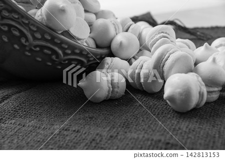 Brazilian sweet meringue, a delicious dessert made of eggs and sugar called "suspiro" in a city in Minas Gerais, Brazil, selective focus. 142813153