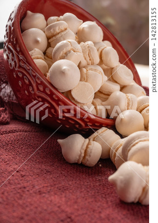Brazilian sweet meringue, a delicious dessert made of eggs and sugar called "suspiro" in a city in Minas Gerais, Brazil, selective focus. Brazilian sweet meringue, a delicious dessert made of eggs and sugar called "suspiro" in a city in Minas Gerais, Brazil, selective focus. 142813155