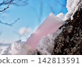 Pink cosmetic tube with moisturizer on snow 142813591