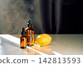 Essential oil dropper bottles with citrus lemon for aromatherapy 142813593